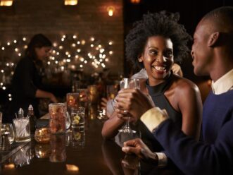 Two people at a bar enjoying the Midtown Atlanta nightlife