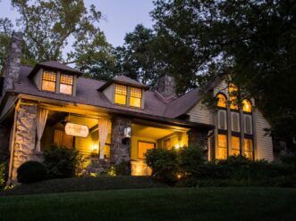 Stonehurst Place lit up at night exterior of the house