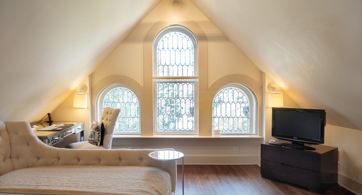 Eaves Room with large arched windows in Stonehurst Place