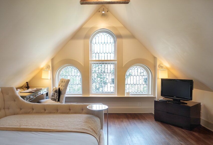 Eaves Room with large arched windows in Stonehurst Place