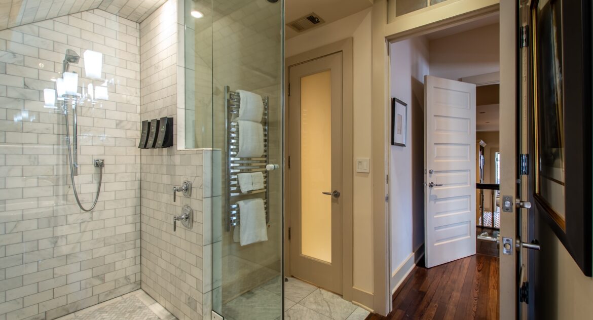 Eaves room bathroom with glass walk-in shower