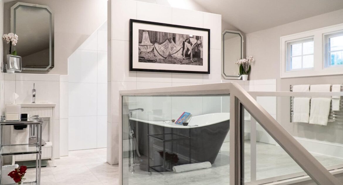Fowler Suite bahtroom soaking tub with black and white picture on wall above in in Stonehurst Place