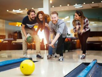 Group of friends enjoying Midtown Atlanta bowling