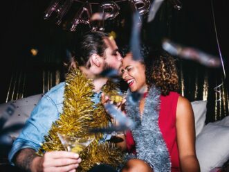 Young couple celebrating New Year's Eve in Midtown Atlanta