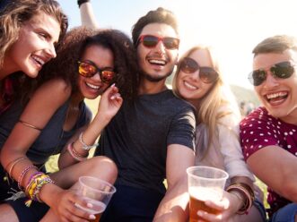 A group of happy people with drinks at the ONE music festival in Atlanta, also known as ONE Musicfest
